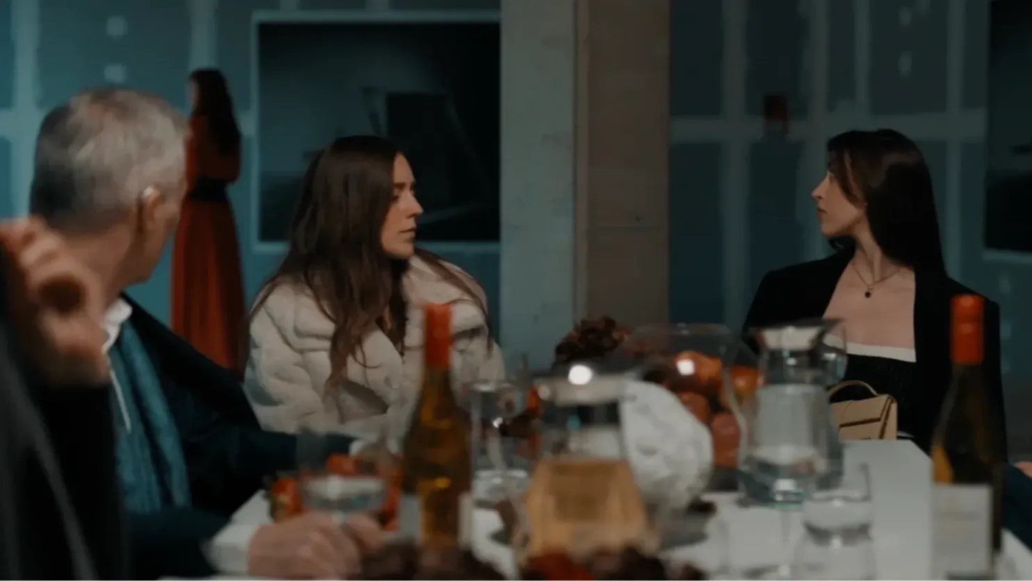 Dinner table scene, psychological control, the wife of an abusive husband is subject by his inner circle of friends to a societal trial and judgement.