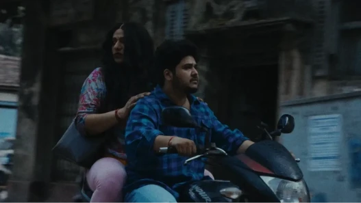 woman and man on a motorbike