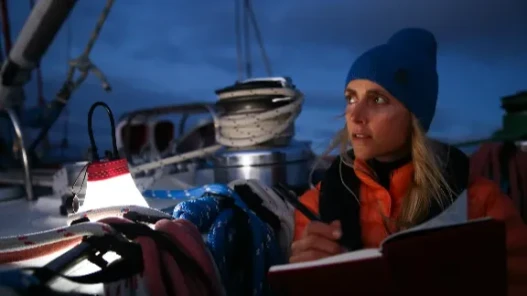 A female sailor on board a yacht in the Great Pacific Garbage Patch