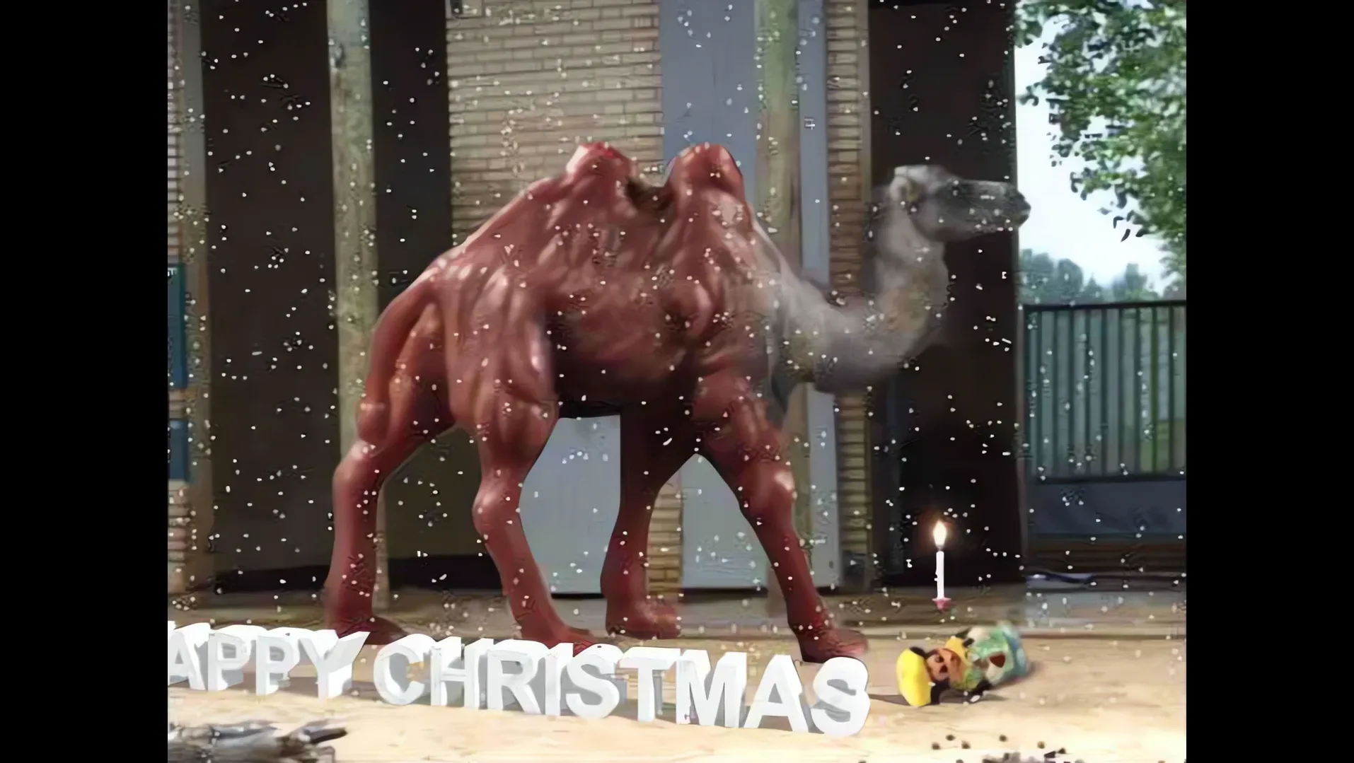 A camel standing by a house with the words Happy Christmas