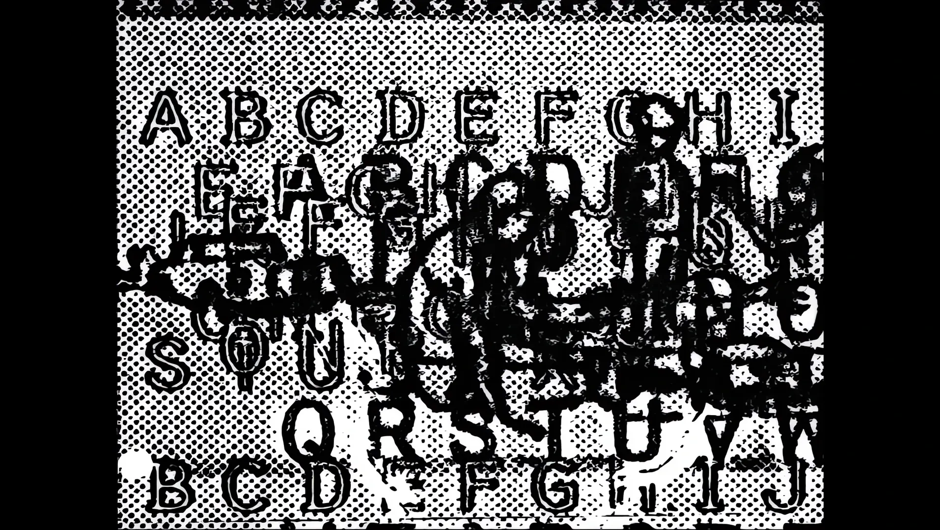 Overlapping letters of the alphabet in black and white