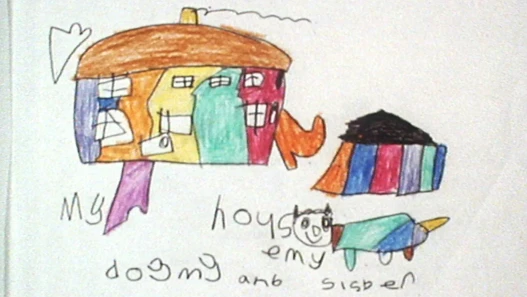 A child's crayon drawing of a striped house, a dog and a sister, captioned 'my house, my dog and sister'
