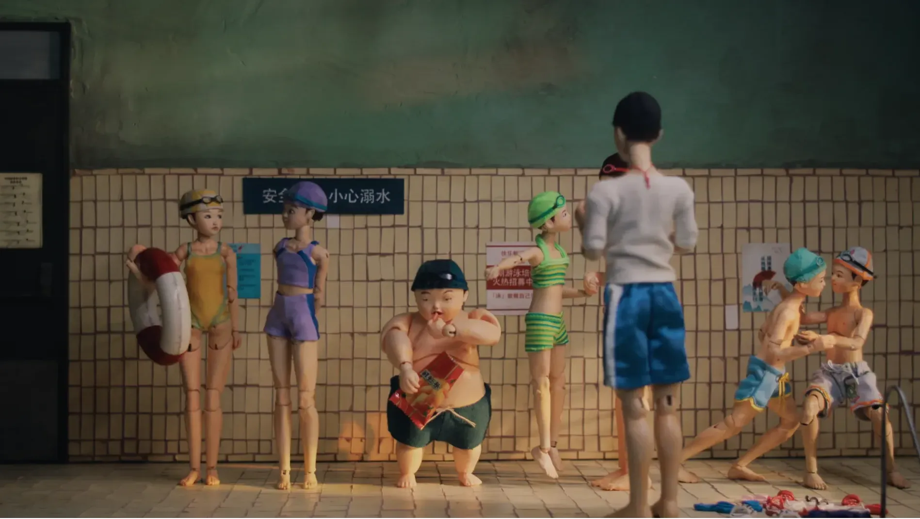 Children assembling poolside for their summer swimming lesson
